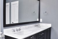 Bathroom Grey Wall And Dark Cabinet With Bathroom Light Fixtures with regard to sizing 1019 X 1536