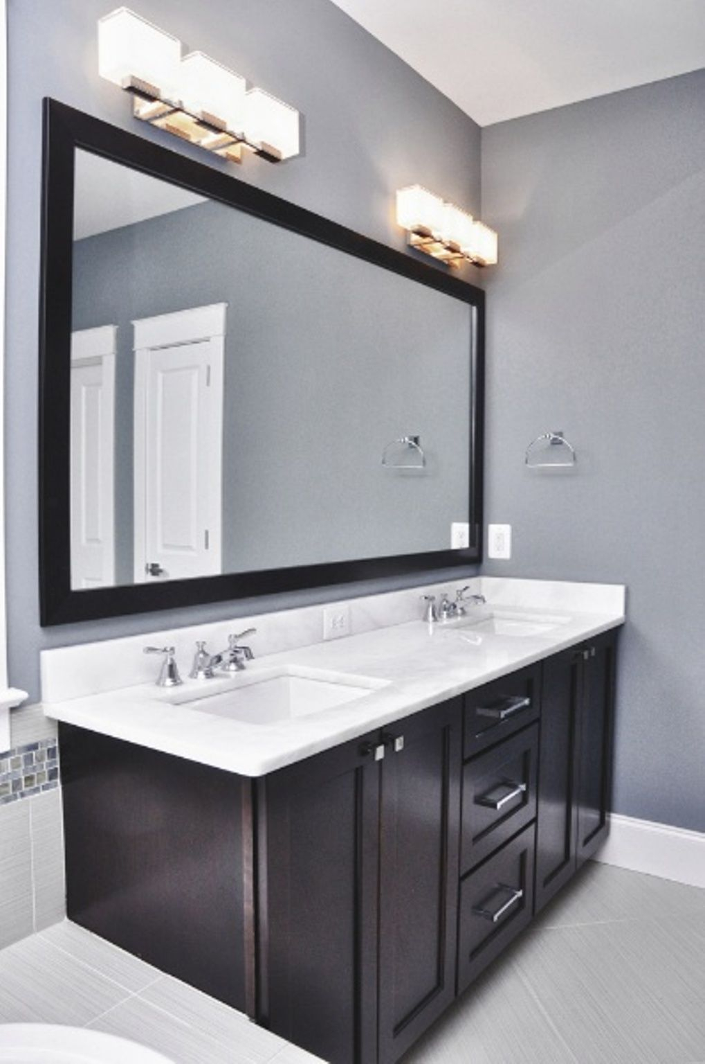 Bathroom Grey Wall And Dark Cabinet With Bathroom Light Fixtures with regard to sizing 1019 X 1536