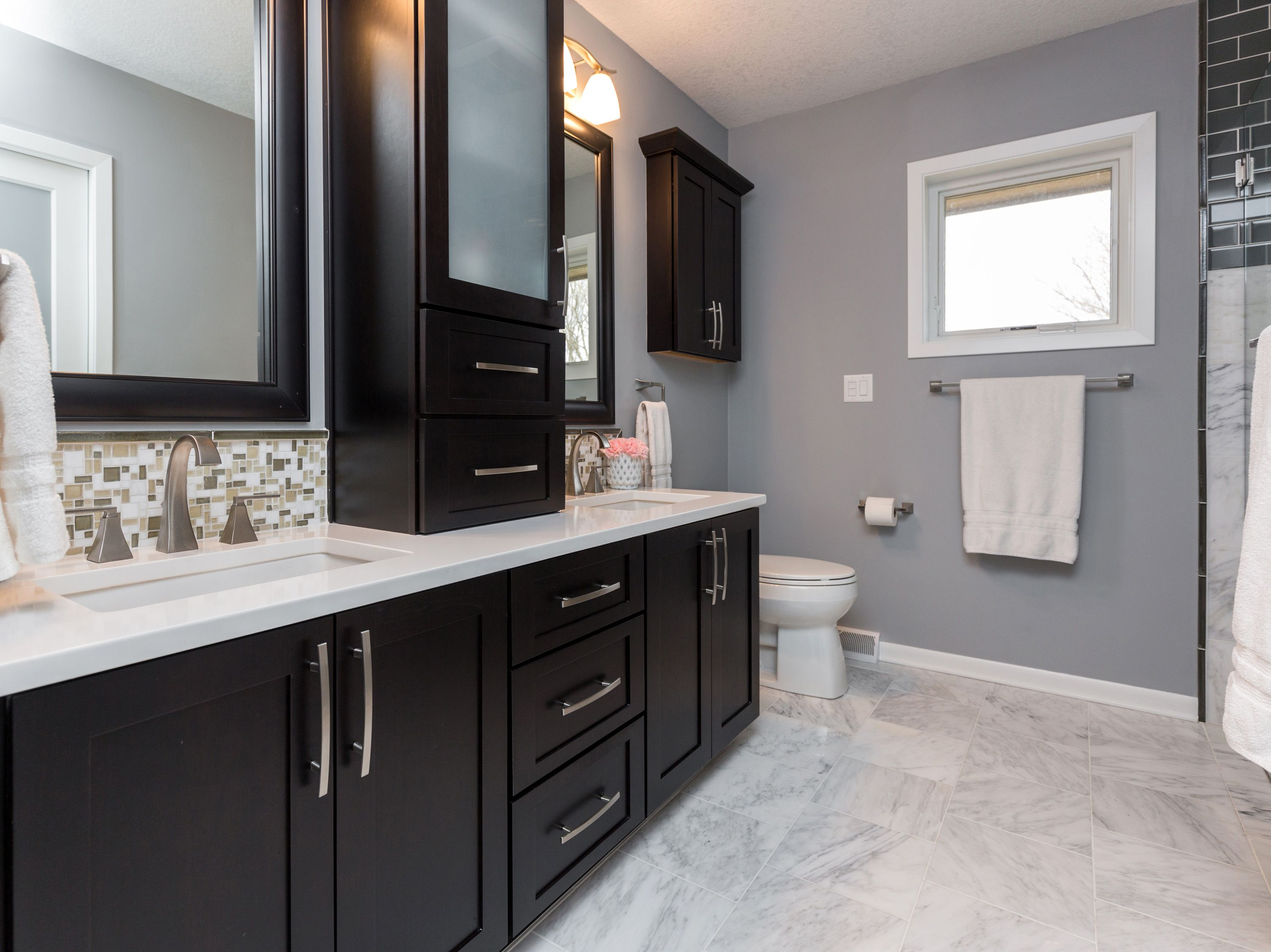 Dark Cabinets White Counter Tops And A Marble Floor Add An Air Of in dimensions 3000 X 2249