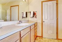 Warm Beige Bathroom With Light Wood Cabinets Stock Image Image Of regarding dimensions 1300 X 1081