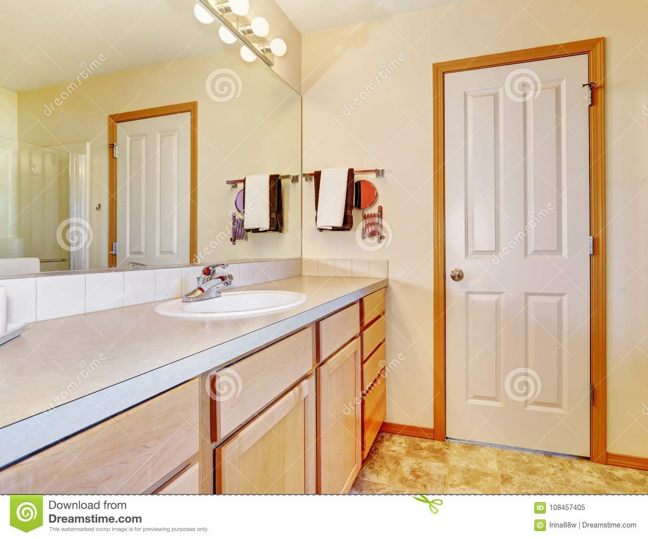 Warm Beige Bathroom With Light Wood Cabinets Stock Image Image Of regarding dimensions 1300 X 1081