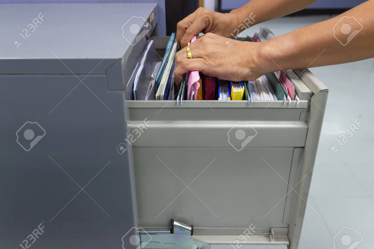 Hand Of Man Search Files Document In A File Cabinet In Work Office with regard to proportions 1300 X 866