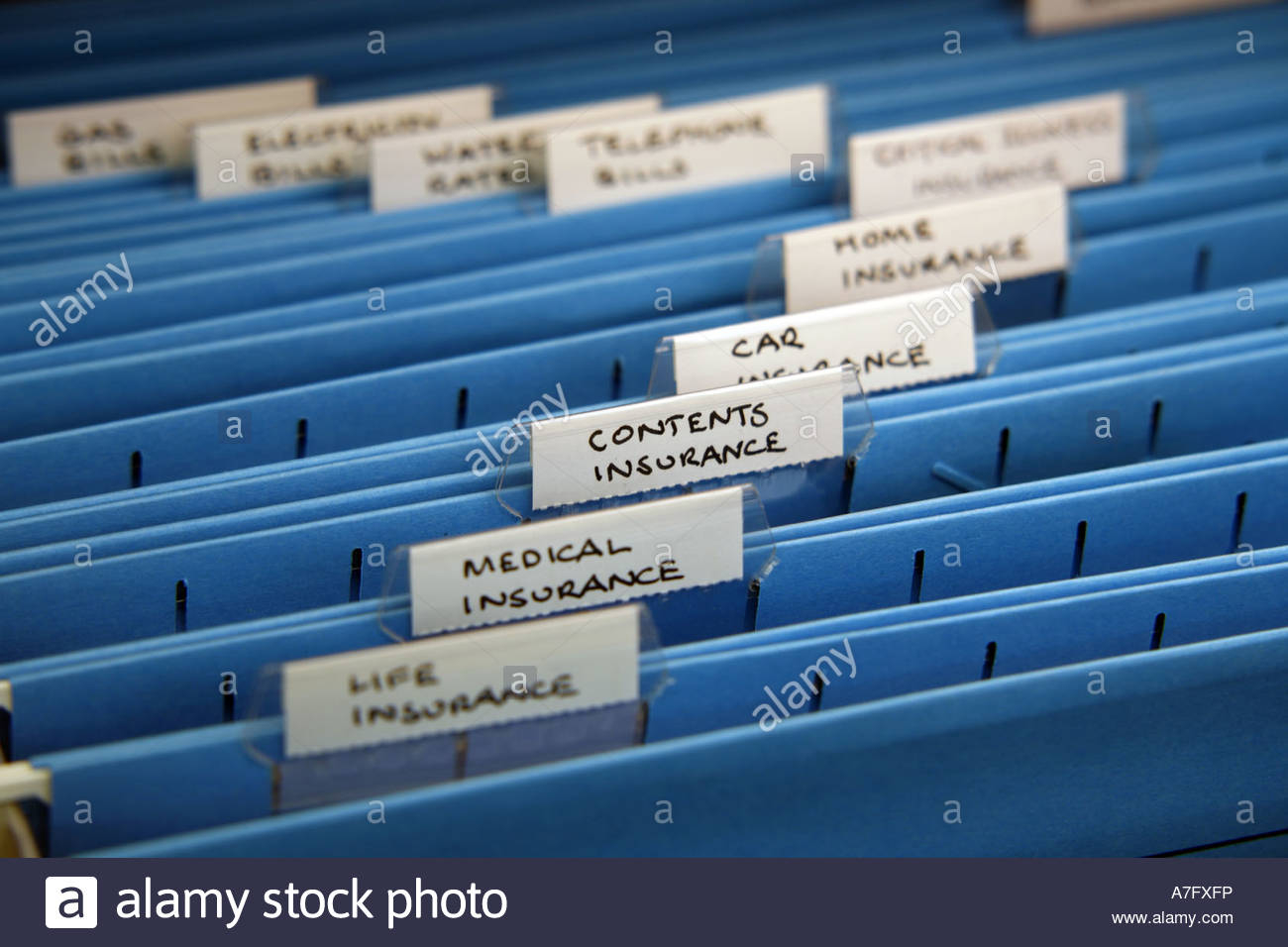 Home Filing Cabinet With Various Insurance Tabs Stock Photo intended for sizing 1300 X 956