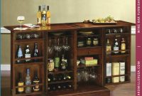 Americana Cherry Hinged Door Portable Wine Bar Cabinet 695116 Howard Miller intended for proportions 900 X 900