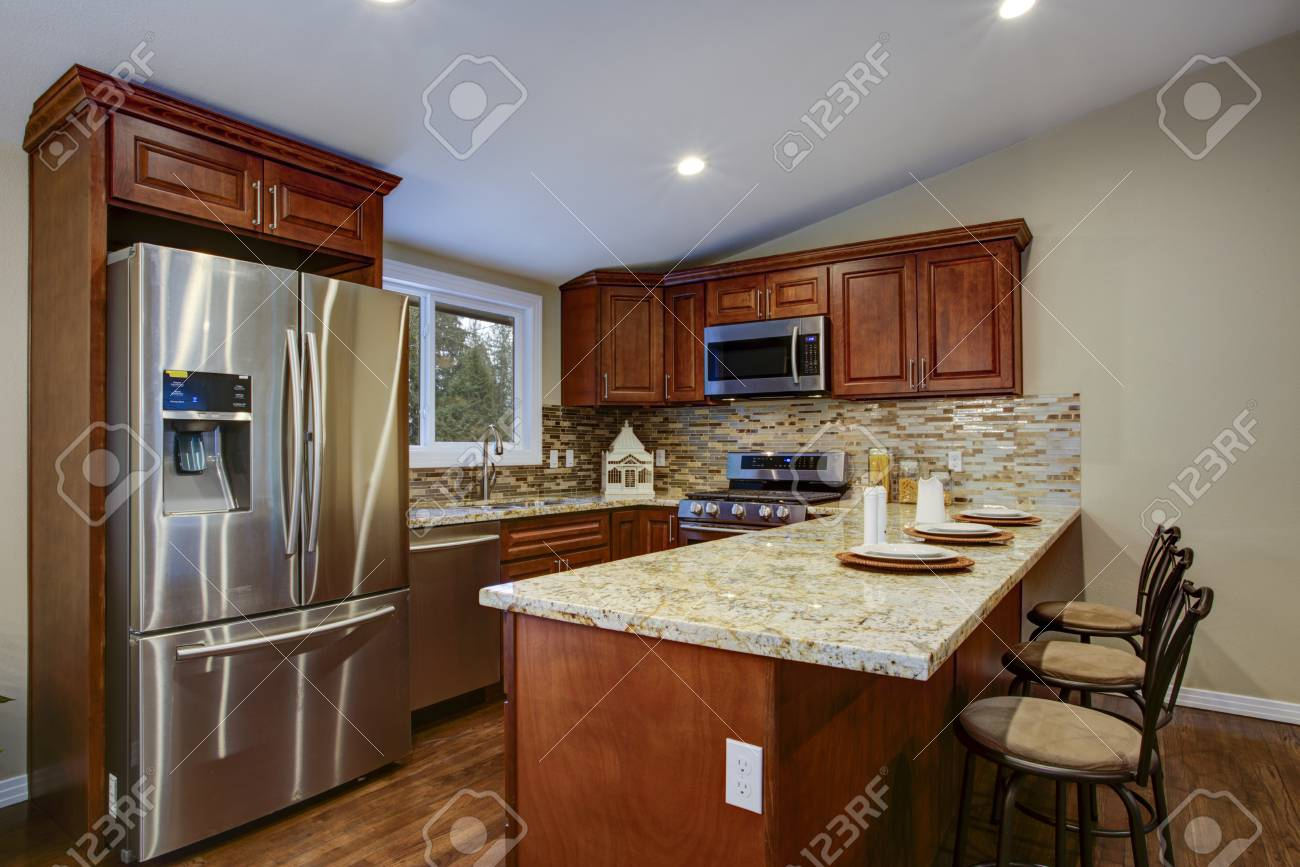 Brown Kitchen Design With Mahogany Kitchen Cabinets Breakfast pertaining to measurements 1300 X 867