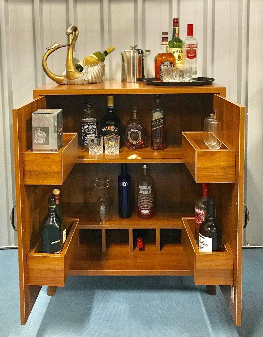 Hide A Bar Cabinet Holds Liquor Bottles On Each Side Of Door in sizing 1056 X 1353