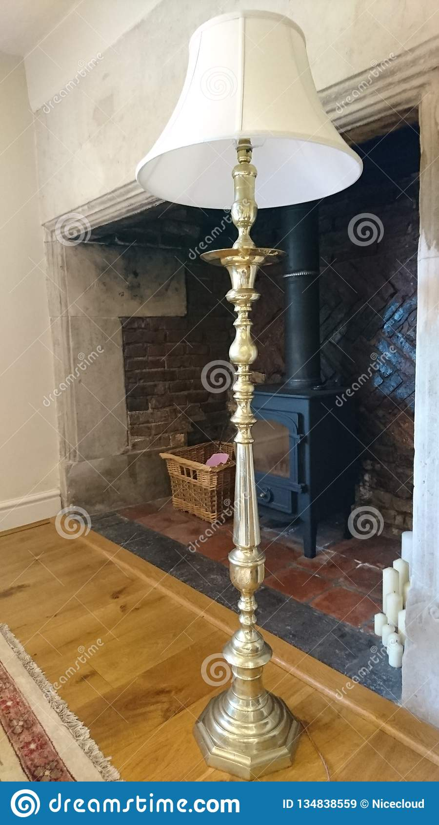 Brass Floor Lamp Standing On A Sideboard Stock Image Image intended for dimensions 900 X 1689
