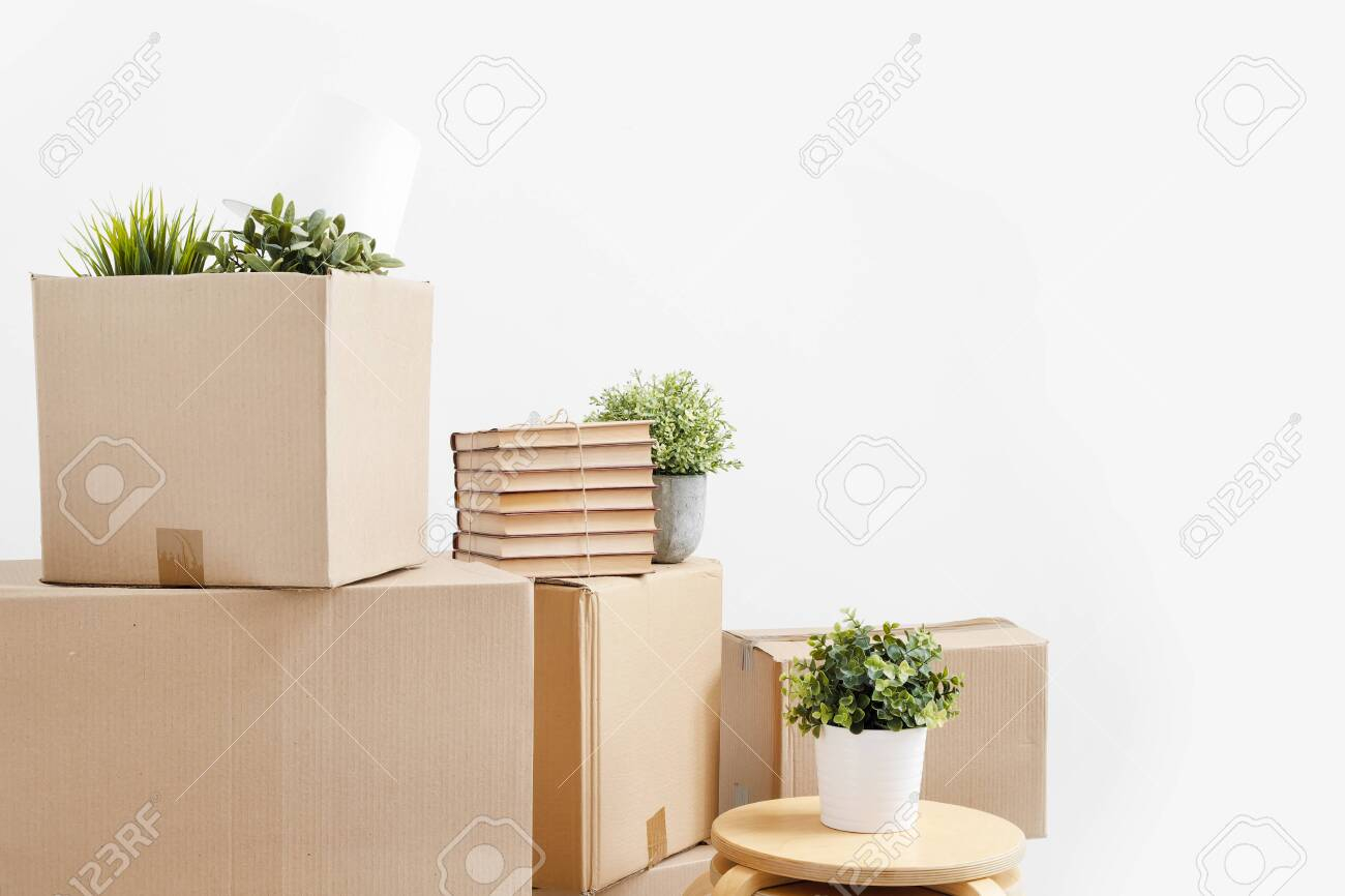 Cardboard Boxes Of Things Are Stacked On The Floor Against A regarding dimensions 1300 X 866
