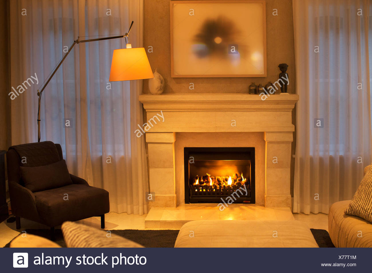 Illuminated Floor Lamp Next To Marble Fireplace Stock Photo intended for measurements 1300 X 956