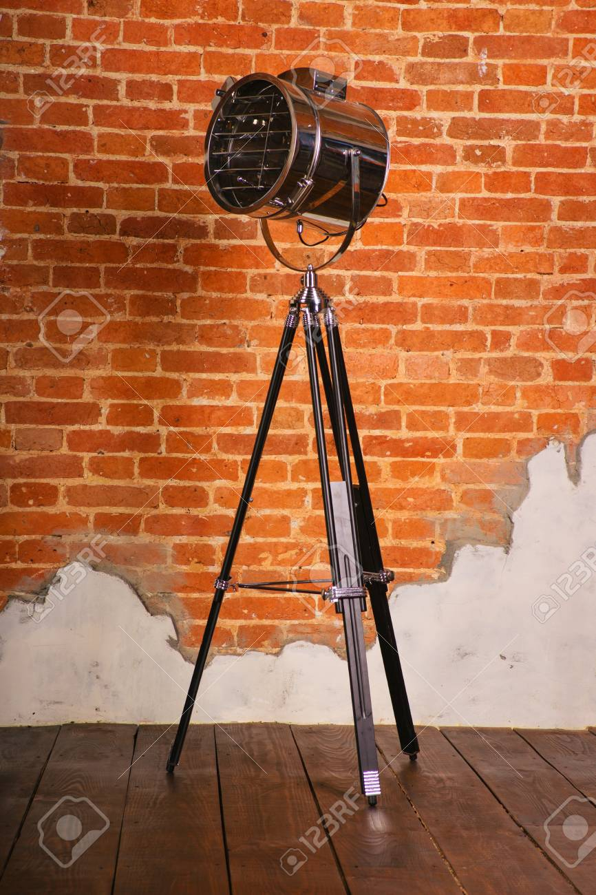 Old Fashioned Floor Lamp On Tripod Near The Brick Wall within dimensions 866 X 1300