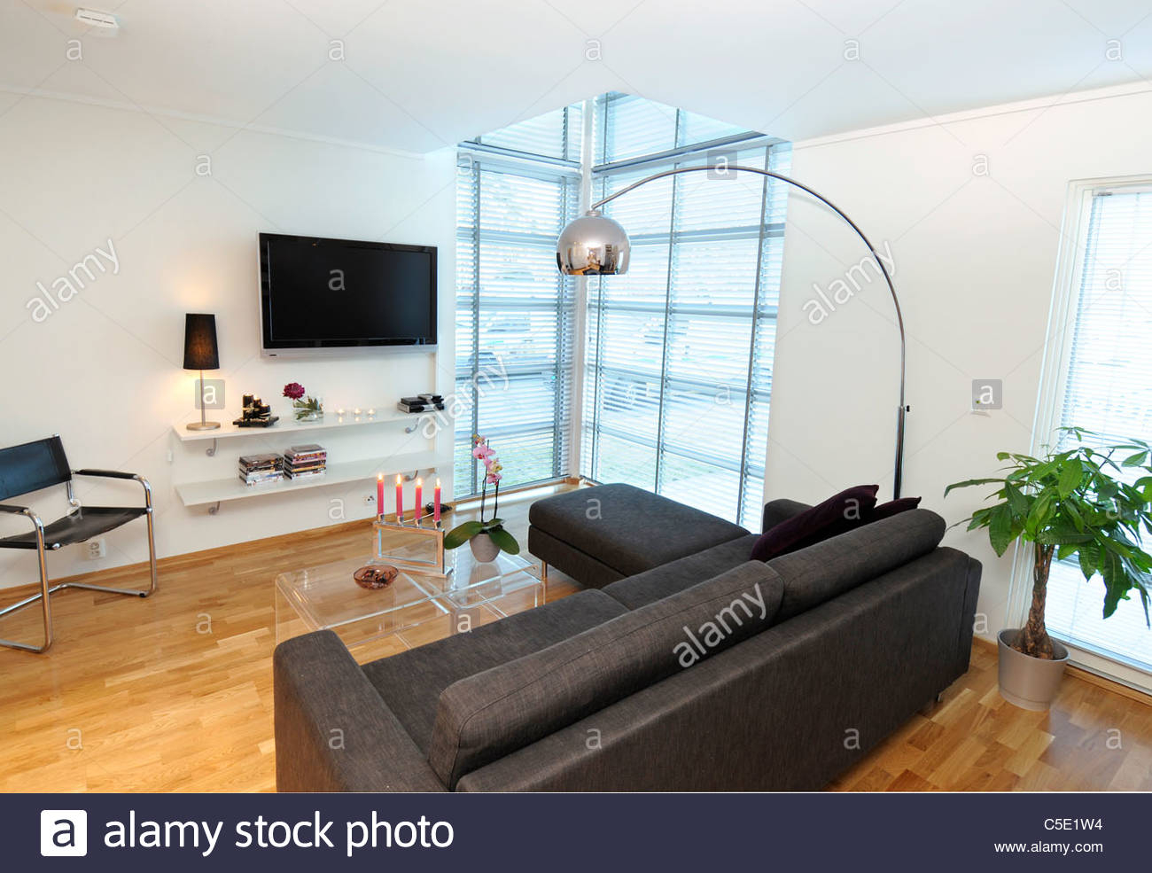 View Of Floor Lamp Over Black Sofa Set With Flat Screen Tv regarding sizing 1300 X 985