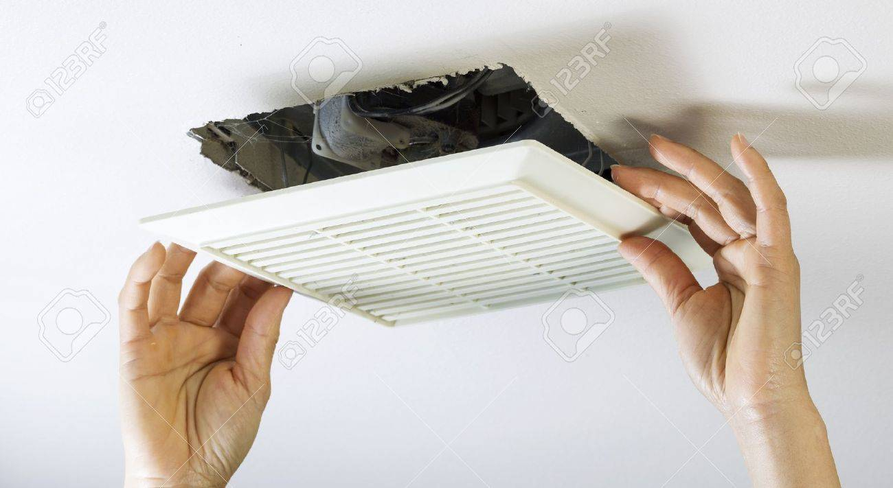 Close Up Horizontal Photo Of Female Hands Removing Bathroom Fan inside dimensions 1300 X 711